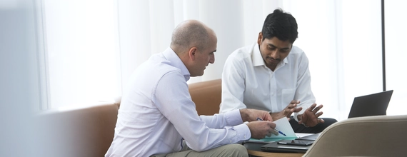 Two businessman speaking